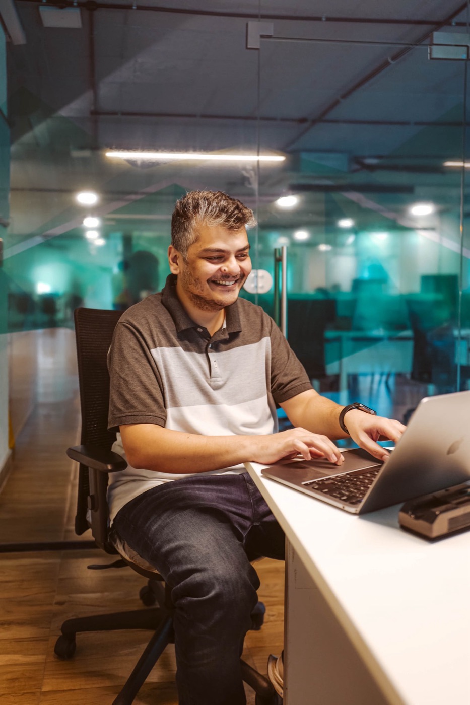 Manas at his desk